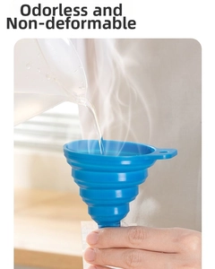 Blue silicone collapsible funnel showing heat resistance while pouring boiling water