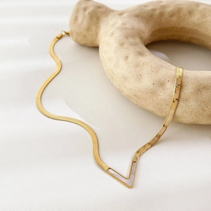 Gold V-shaped pendant necklace with shell inlay on minimalist herringbone chain for women