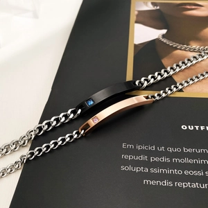 Polished stainless steel couple bracelets in black and rose gold with small crystals