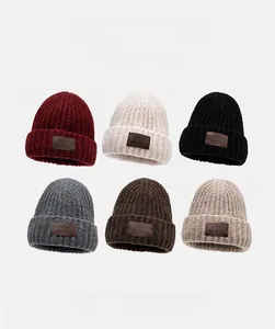Detailed grid view of chunky knit ear-protection beanies in six various autumn colors