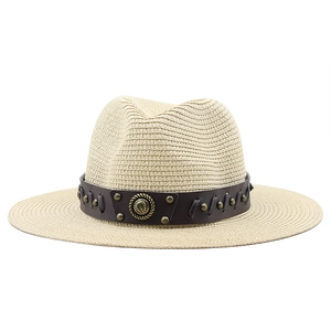 Classic straw cowboy hat in beige with studded leather band and vintage metal emblem