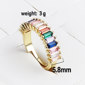 Macro detail of 5.8mm gold ring featuring vibrant rainbow baguette-cut cubic zirconia stones