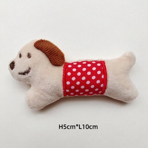 Detail showing plush dachshund doll dimensions 5cm height by 10cm length in cream and red