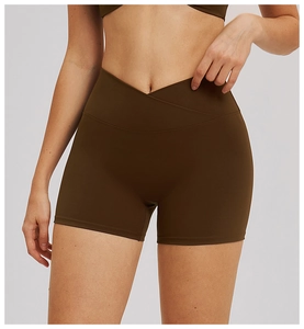 Close-up of deep brown high-waisted yoga shorts with V-cross waistband for gym fitness