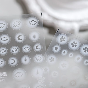 Matte ultra-thin nail stickers with white clouds, moons and star patterns on white ceramic