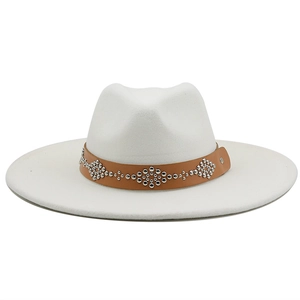 Detail of white wool jazz hat featuring a brown leather strap with silver metal studs