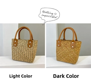Detail view of woven straw tote bags in light and dark shades with brown leather handles