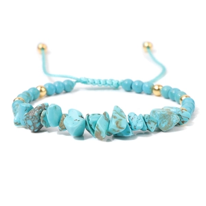 Detail of adjustable blue woven bracelet with turquoise stone chips and gold beads