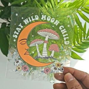 Rainbow suncatcher window cling with Stay Wild Moon Child text and mushroom designs