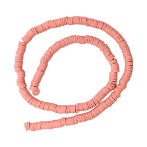Strands of coral pink polymer clay heishi beads for DIY jewelry making and crafts