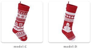 Detail view of red knitted Christmas stockings with snowflake and snowman patterns