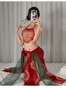 Detail of red halter neck top with gold embroidery and green sheer skirt set