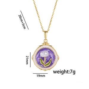 Golden flower necklace with purple enamel pendant, white pearl flowers and green leaves