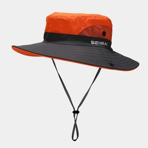 Detail of outdoor sun hat featuring orange breathable mesh and adjustable chin strap