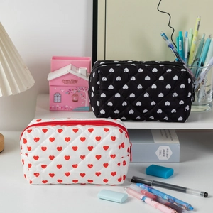 Quilted cotton cosmetic bags with heart patterns in white and black styles