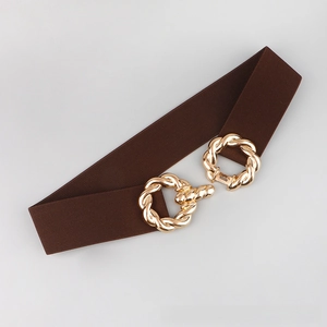 Detailed shot of dark brown elastic waist belt with interlocking gold twisted rings