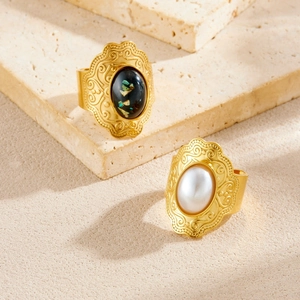 Vintage gold-plated stainless steel oval rings with shell inlay and pearls on stone base