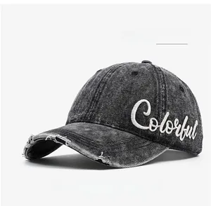 Close-up of distressed charcoal denim baseball cap with white Colorful embroidery