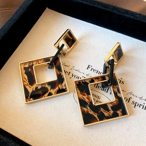 Exaggerated leopard print square drop earrings with gold finish and geometric links