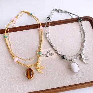 Collier hirondelle vintage en acier inoxydable avec pendentif ovale et perles colorées