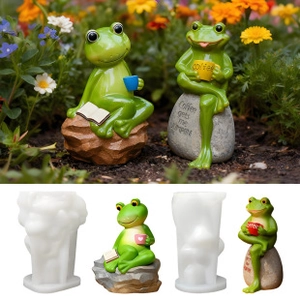 Detail view of frog-shaped silicone molds with finished resin crafts for garden decor