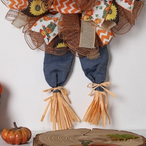 Autumn Thanksgiving wreath with sunflower ribbons, pumpkin patterns and scarecrow legs