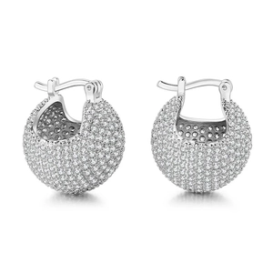 Close-up of pavé set round crystal hoop earrings with polished silver finish