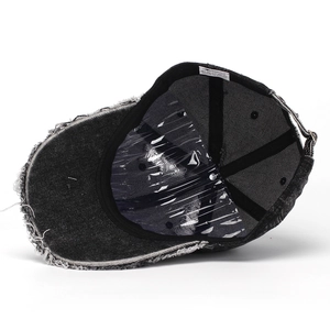 Distressed black denim baseball cap with 100% cotton inner tag and white frayed edges