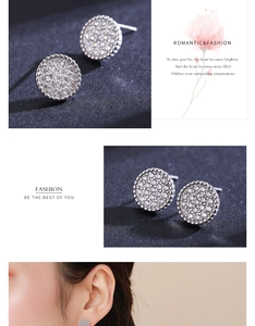 Macro detail of round S925 sterling silver stud earrings with micro-pave cubic zirconia