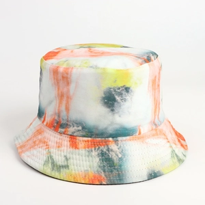 Detailed view of tie-dye bucket hat stitching and vibrant orange-yellow artistic fabric