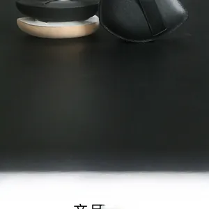 Macro view of XL marshmallow makeup puffs in black and nude for foundation application