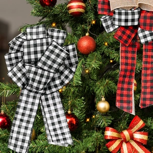 Christmas plaid fabric bows in red, black, and gold glitter on a decorated holiday tree