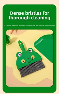 Detail of dense PET bristles on a green frog mini broom for thorough desk cleaning