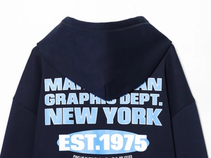 Detail of navy blue hoodie featuring Manhattan graphic print on the back with sharp lettering