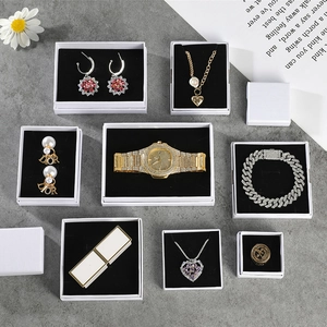 Luxurious gold jewelry set with watch, necklaces and earrings in a premium gift box