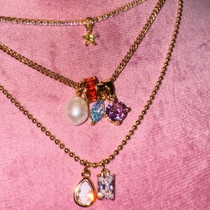 Three-layer gold necklace set featuring star, pearl, and colorful zircon stone pendants