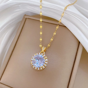 Detailed close-up of a large round cubic zirconia necklace on a beige display stand
