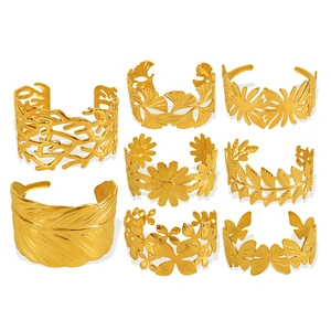 Titanium steel bangles featuring butterfly and leaf cutout patterns in a gold finish