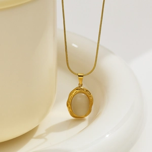 Vintage stainless steel necklace with oval opal pendant and gold hammered metal texture