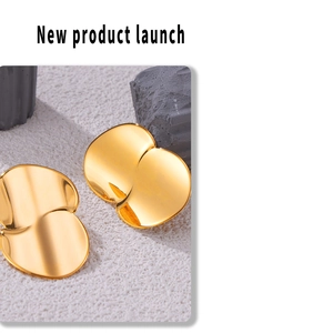 Detailed view of gold plated titanium steel earrings with irregular double layer design