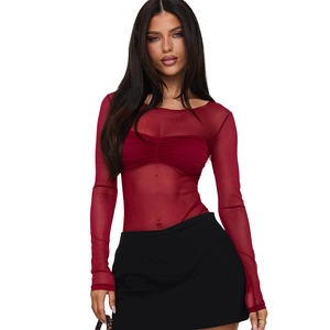 Close-up of red mesh sheer long sleeve top with slim fit design and delicate fabric texture