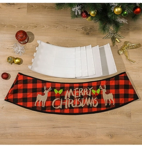 Detail of red and black buffalo plaid Christmas tree collar with Merry Christmas embroidery