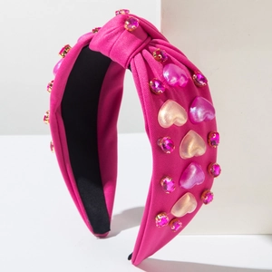 Diadema con nudo rosa con corazones de resina y diamantes en soporte geométrico