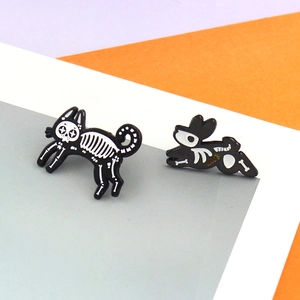 Skeleton cat and rabbit enamel pins set with carrot detail on colorful background