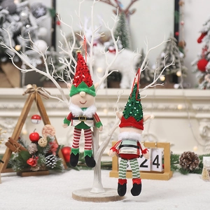Christmas elf doll hanging ornaments with sequins and striped legs on a festive tree branch