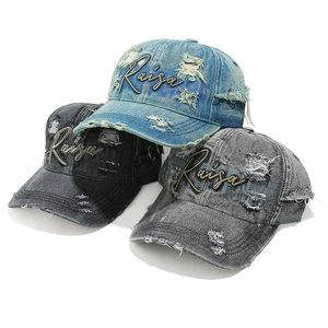 Washed denim baseball cap with Raisa gold embroidery and metal ring details