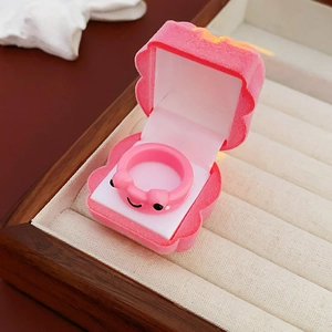 Pink cartoon animal ring presented in a cute shell-shaped velvet jewelry box