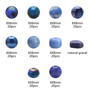Detail view of blue glass beads and natural gravel for DIY jewelry making material kits