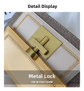 Detail of yellow and beige bags showing golden metal locks and wheat embroidery