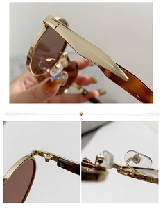 Detailaufnahme der goldenen Metallscharniere und der Brillenbügel in Schildpatt-Optik